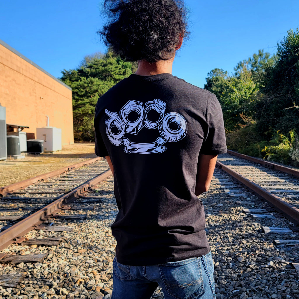 Black cotton short-sleeved T-shirt with Problem Solver brass knuckle design on back in white ink
