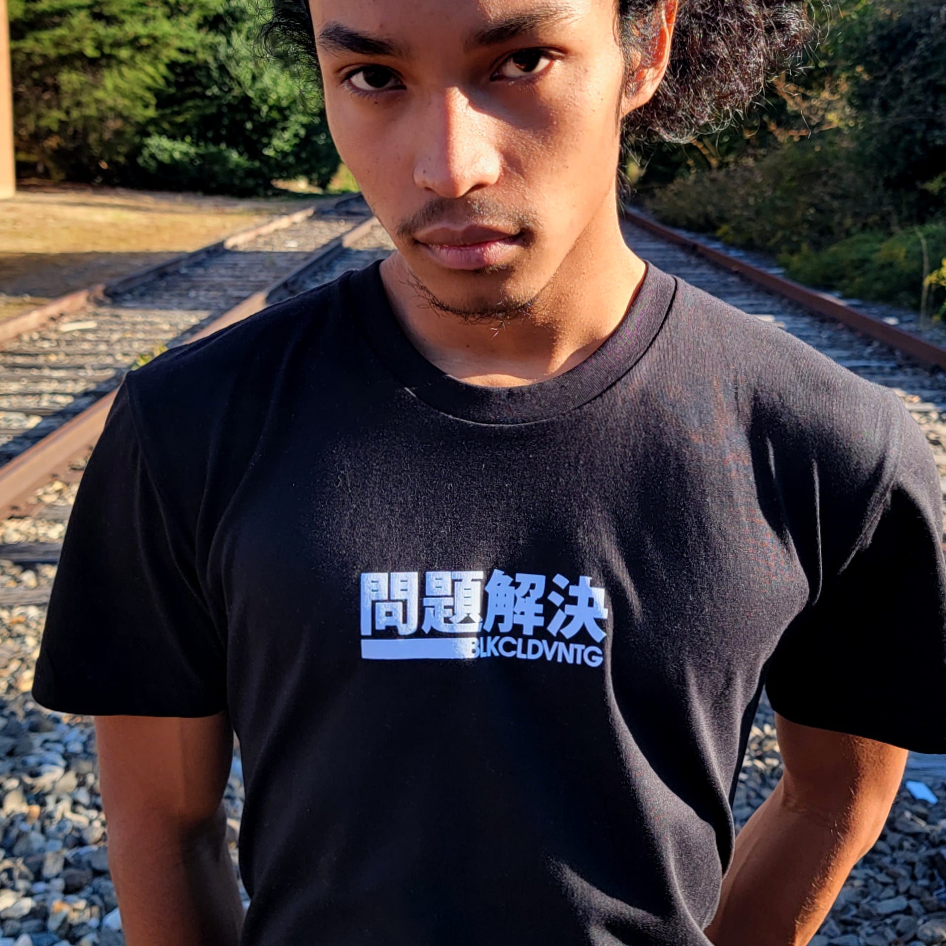 Black cotton short-sleeved Problem Solver T-shirt with BLK CLD Vintage design on front in white ink