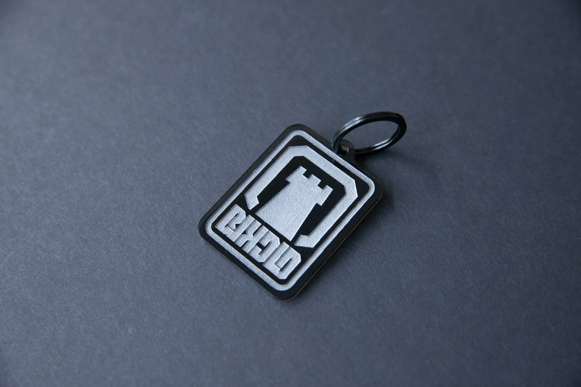 BLK CLD castle engraved acrylic keychain.&nbsp;