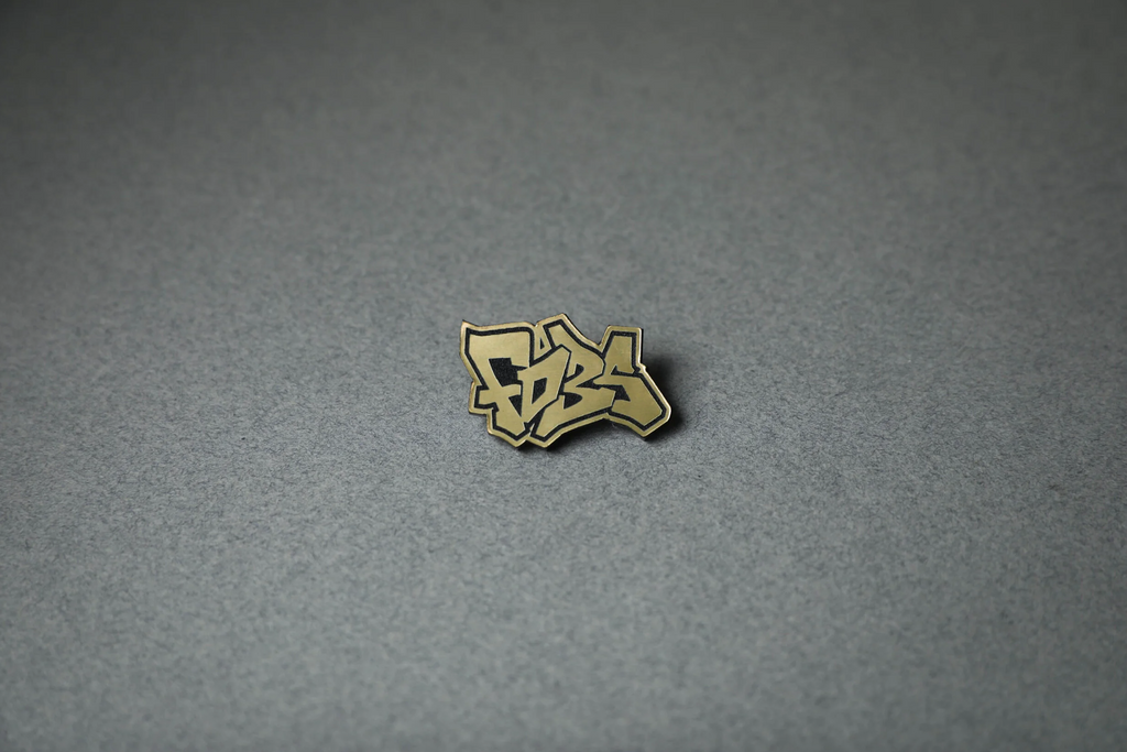 gold FD3S acrylic lapel pin