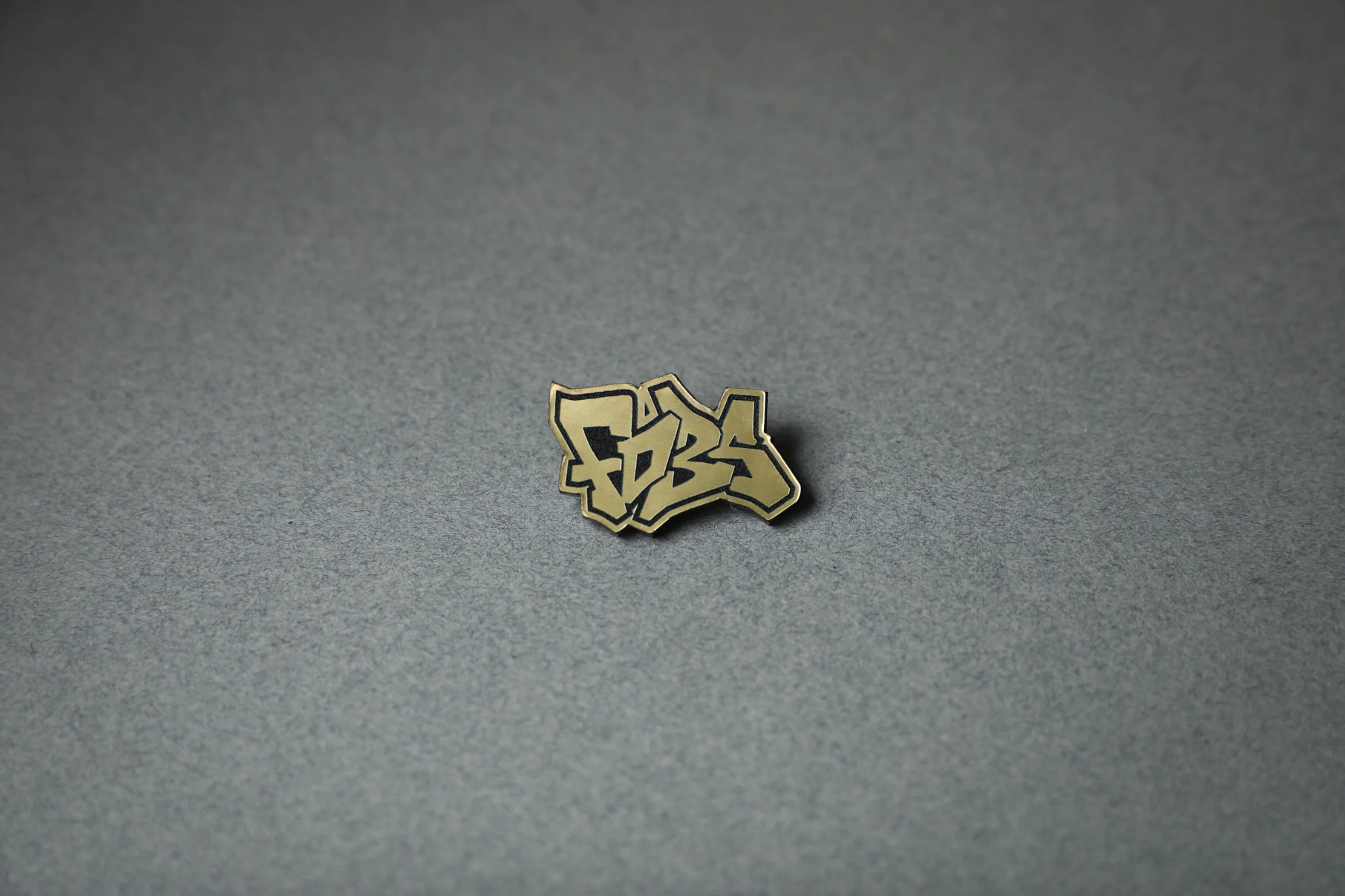 gold FD3S acrylic lapel pin