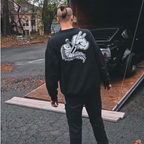 Unisex black crewneck sweatshirt with tōge (roadway) chest emblem on front and conquering the tail of the dragon design on back in white.