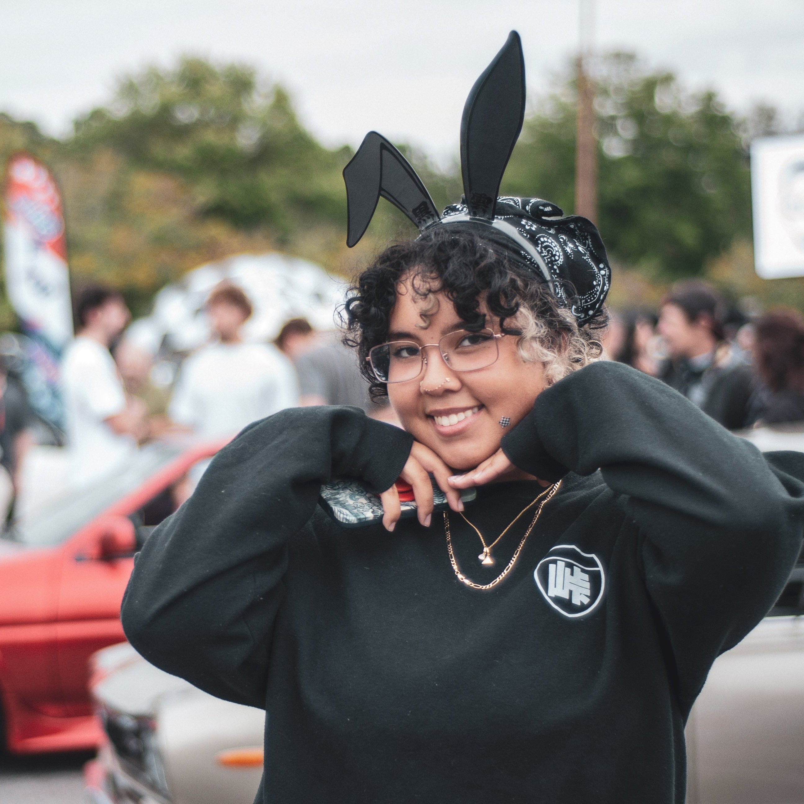 Black laser-engraved acrylic Black Cloud rabbit ears on a velvet black headband with Tail of the Dragon crewneck sweatshirt